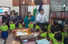 Police Commissioner interacts with pre-school kids